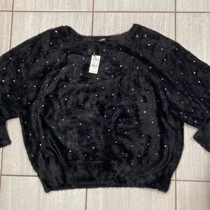 Woman’s Express sweaters with bling